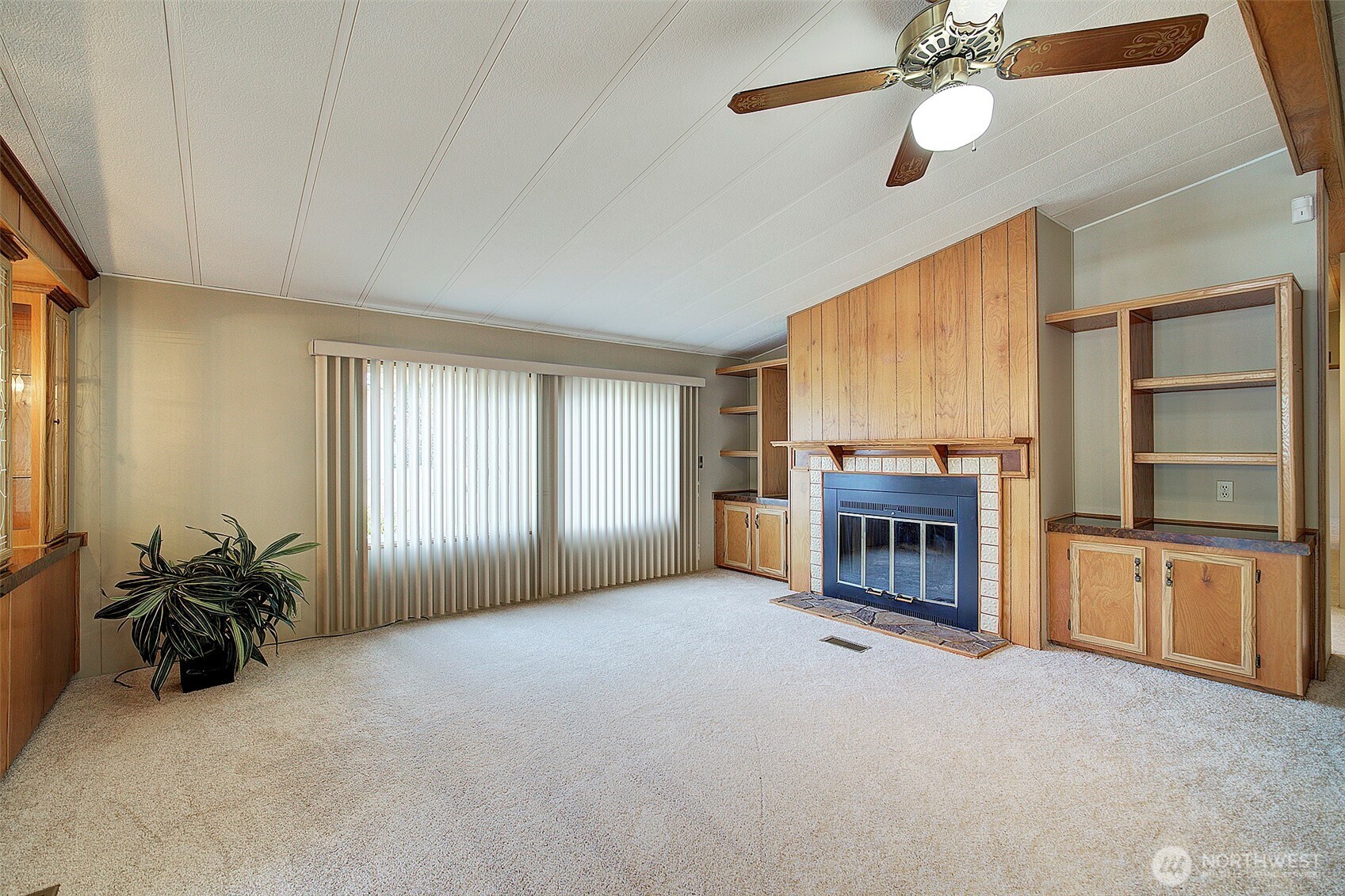 Family room, new windows, carpet & wood burning fireplace