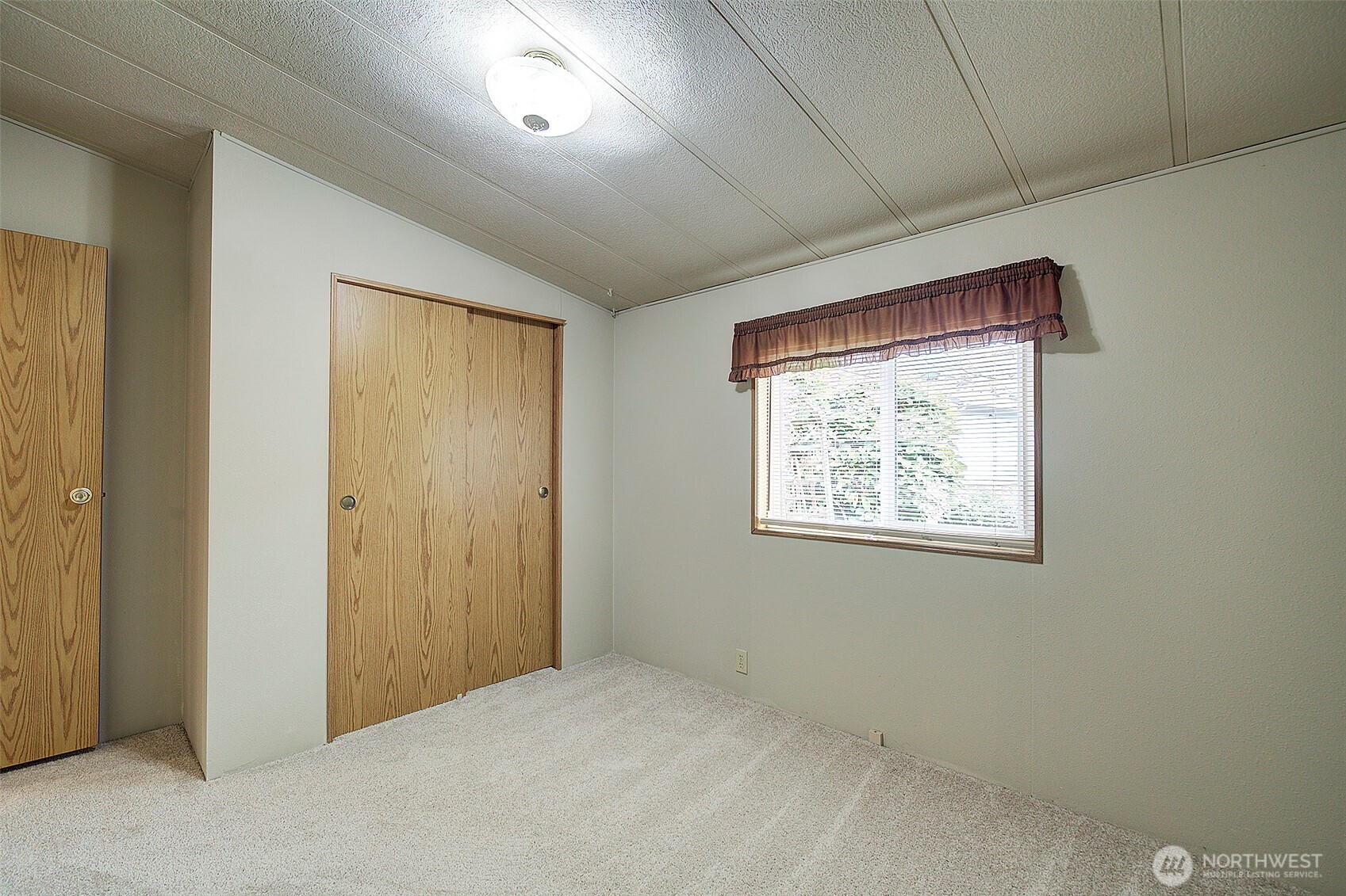 3rd Bedroom w/large closet, new carpet & new triple pane window