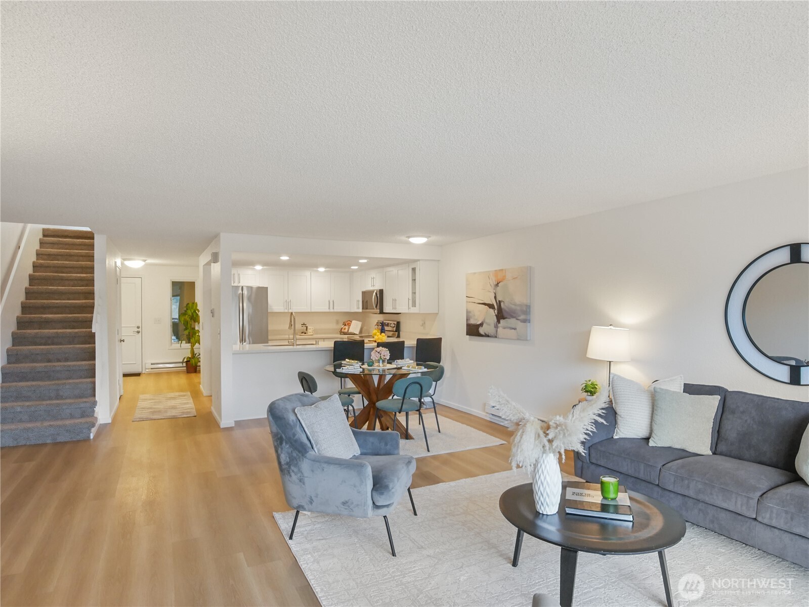 Generous family room flows to lakefront deck.