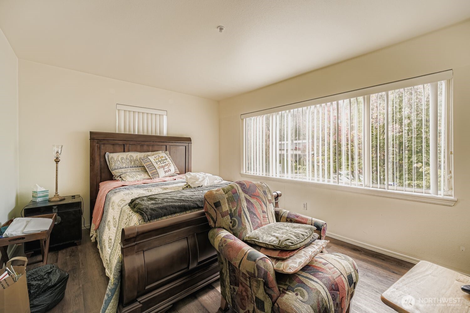 Retreat to a spacious primary bathroom featuring a double-sink vanity, modern lighting, and a large mirror that enhances natural brightness. The glass-enclosed shower and dual-tone walls add a touch of sophistication, while the adjacent walk-in closet offers generous storage and seamless flow from the primary bedroom. Stylish finishes and thoughtful layout make this space both functional and luxurious.