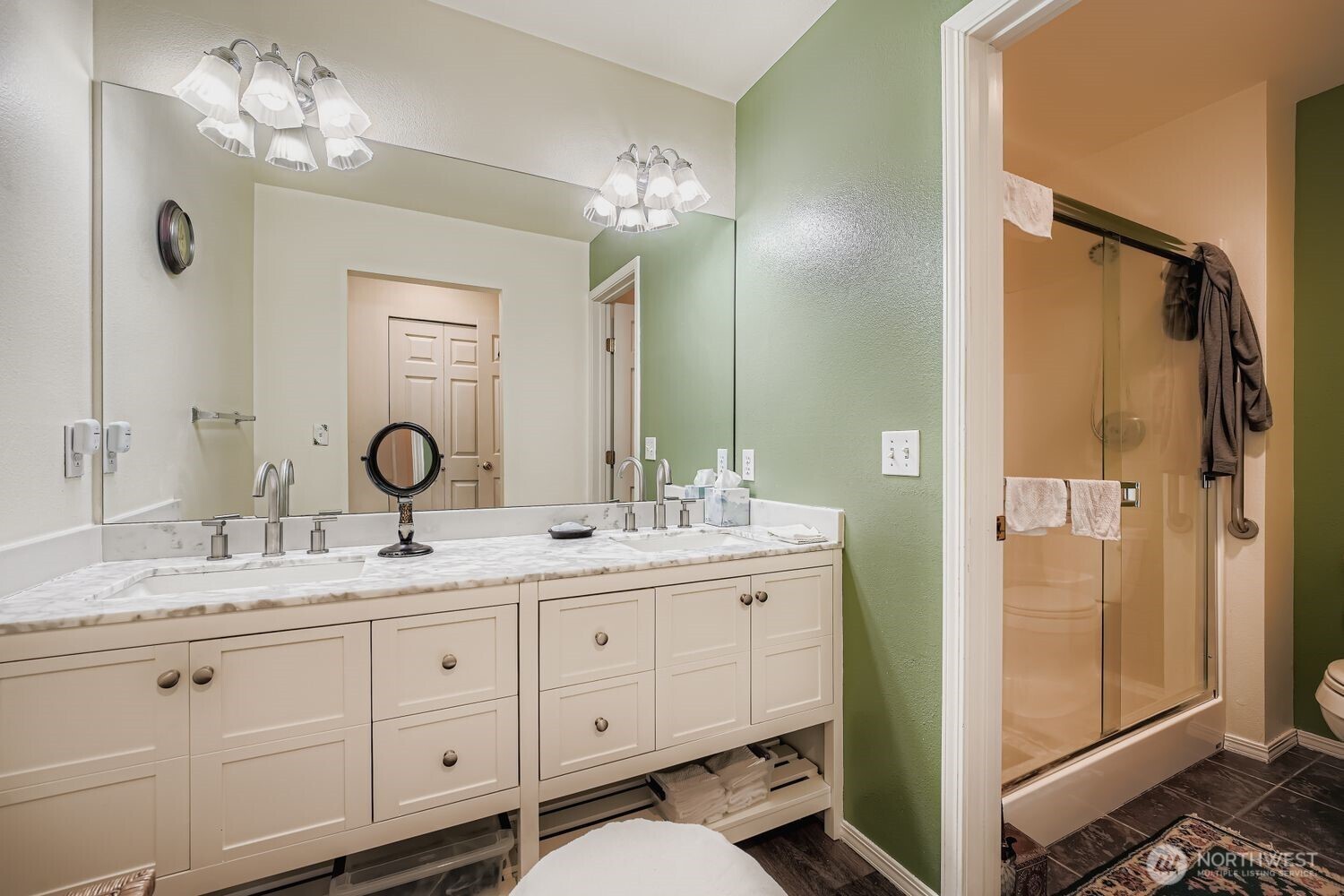 This spacious second bedroom offers a serene retreat with soft natural light and a calming neutral palette. A large window frames peaceful outdoor views, while plush carpeting adds warmth underfoot. Ideal for guests or family, this room combines comfort and versatility in a quiet corner of the home.