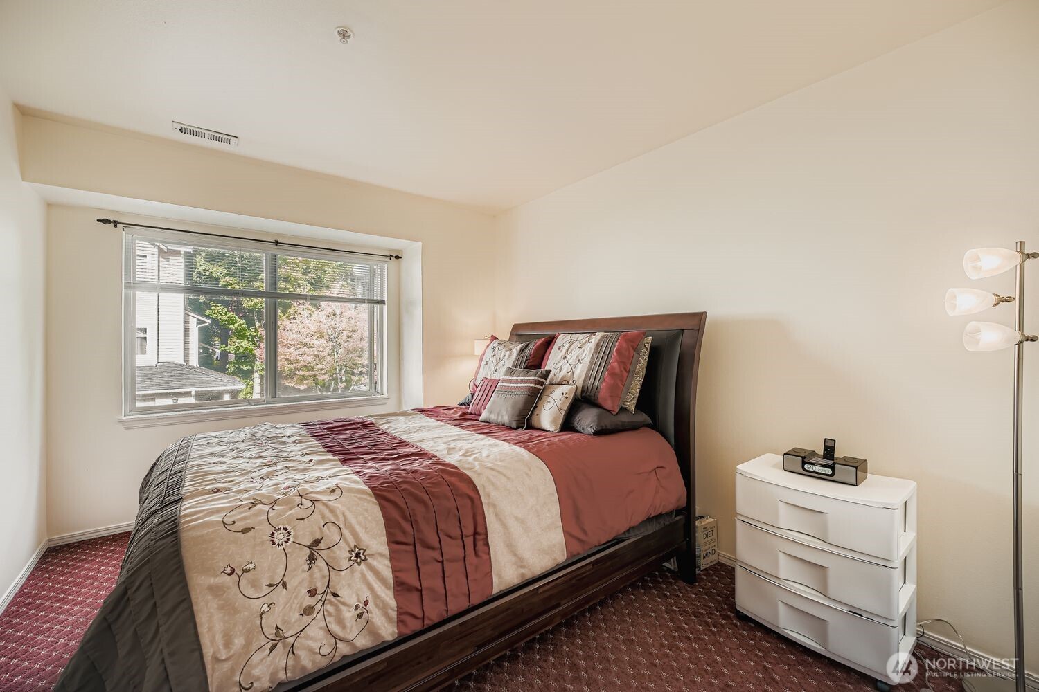 This light-filled room offers the perfect blend of function and flexibility, ideal as a dedicated home office, guest bedroom, or creative space. A large window brings in natural light and frames a peaceful view, while built-in storage and neutral tones create a calm, productive environment. With direct access to the hallway and adjacent living areas, this space adapts effortlessly to your lifestyle needs.