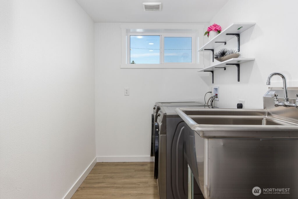 Utilities/laundry room. Extra large sink for your needs. Even pet grooming possible here!
