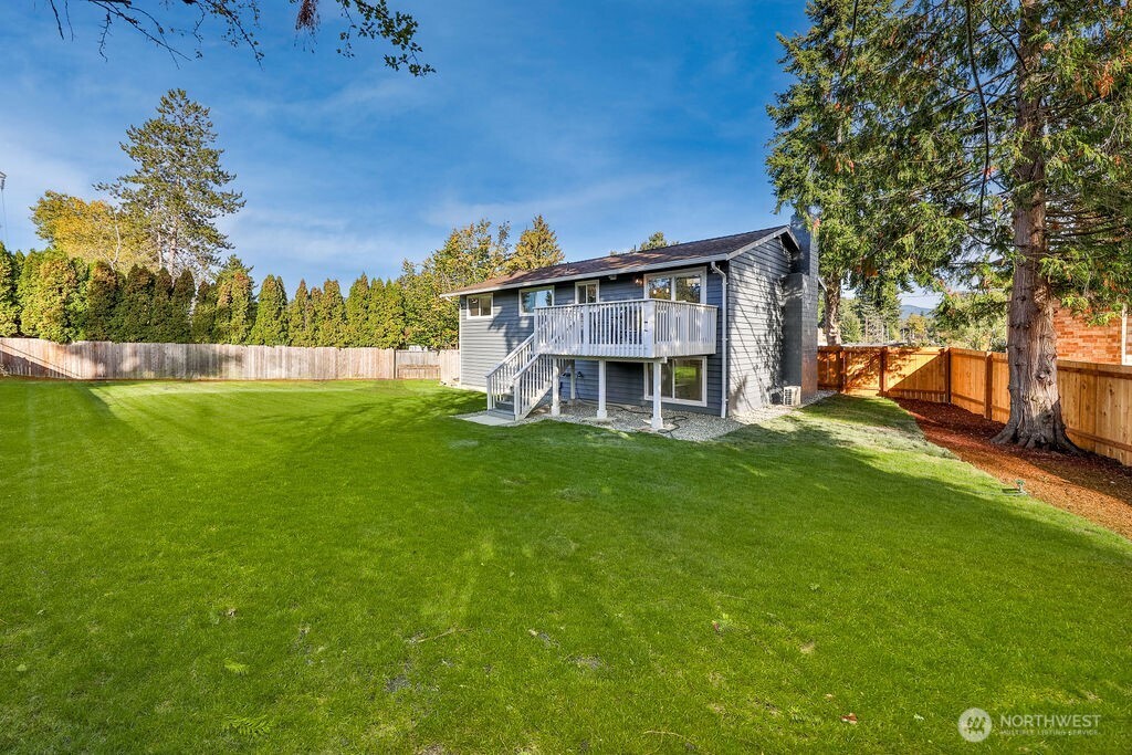This spacious yard has confirmed eligibility under renton's Permit-Ready ADU program. On the other side of the fence is a curb cut with ready separate access.