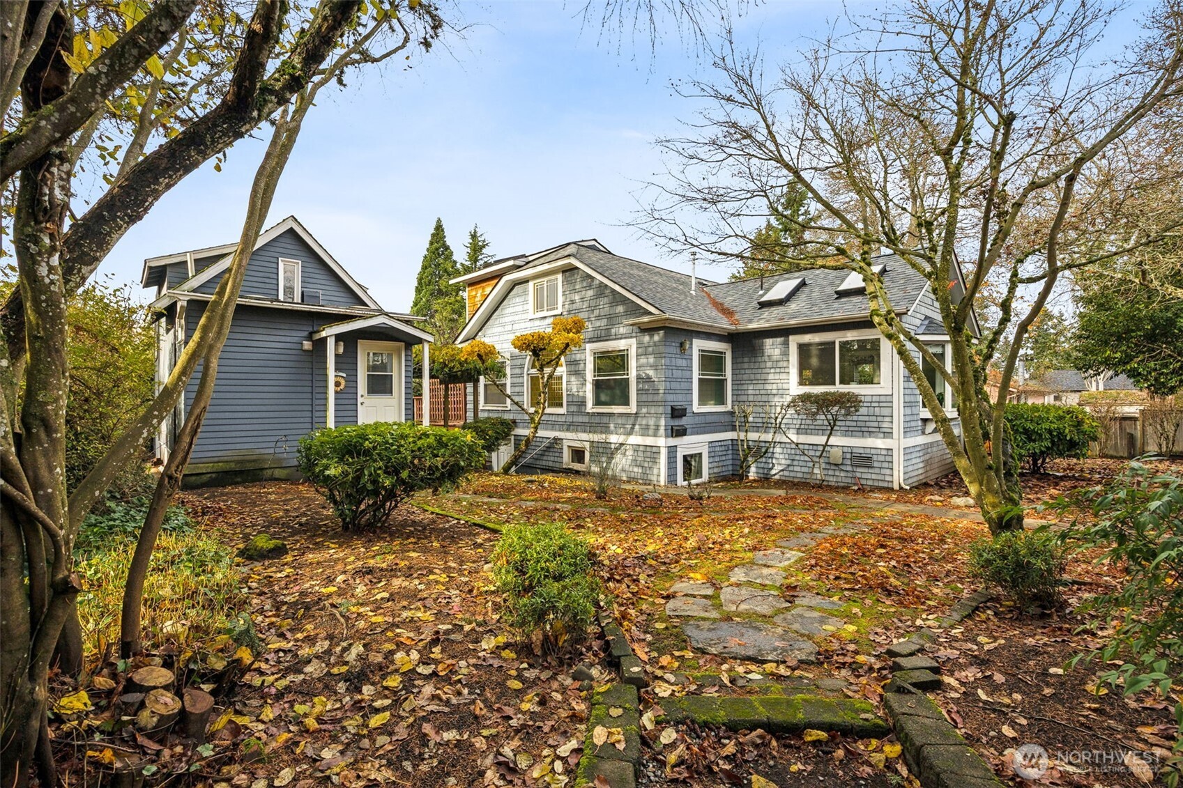 Charm abounds with this 1916 craftsman and cottage!