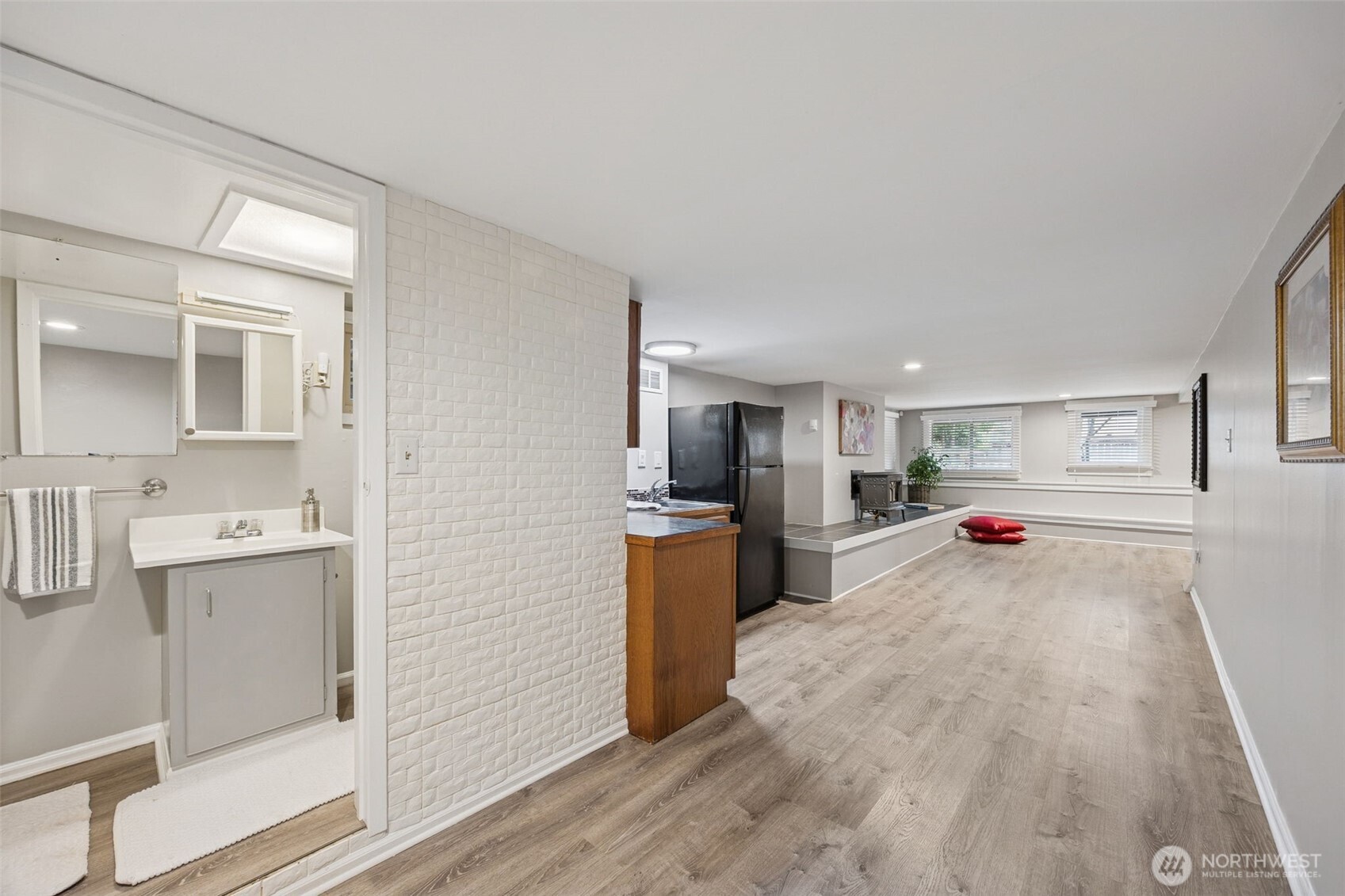 The lower level features separate living quarters - 1 bed, 3/4 bath, mini kitchen, separate entry and shared laundry.