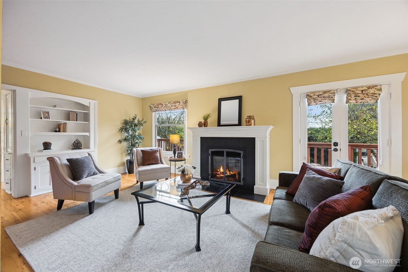 Living room with gas fireplace and access to the spacious deck
