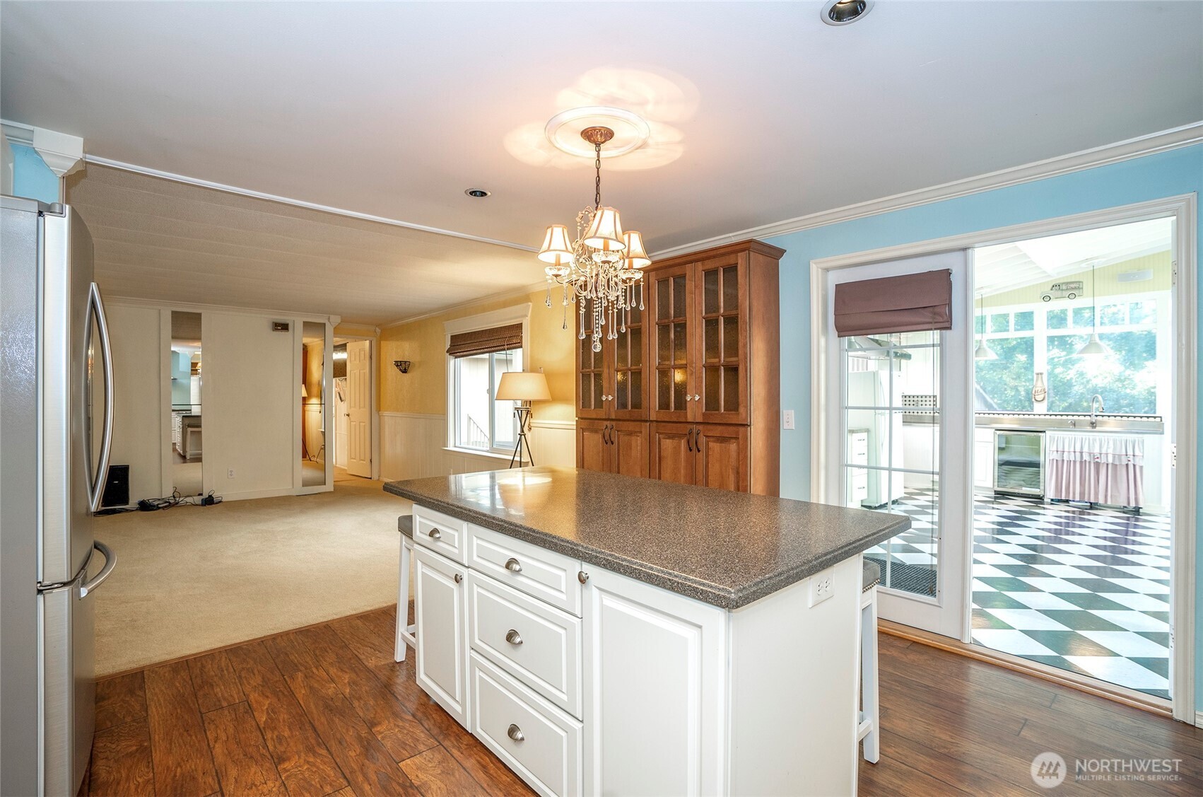 From the kitchen, take in the open layout connecting the dining and living areas.