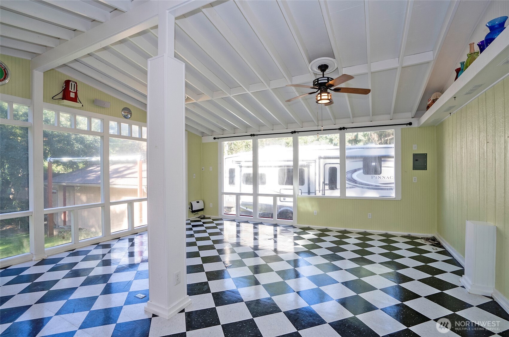 Step out from the kitchen to a covered, enclosed entertaining area with views of the immaculate yard, virtually staged to inspire!