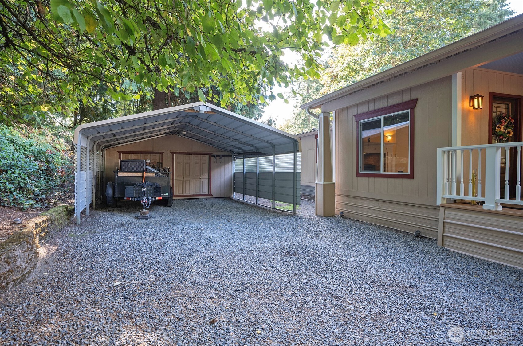 One of the multiple outbuildings - 16x8 featuring insulated flooring and shelving that spans the entire wall.