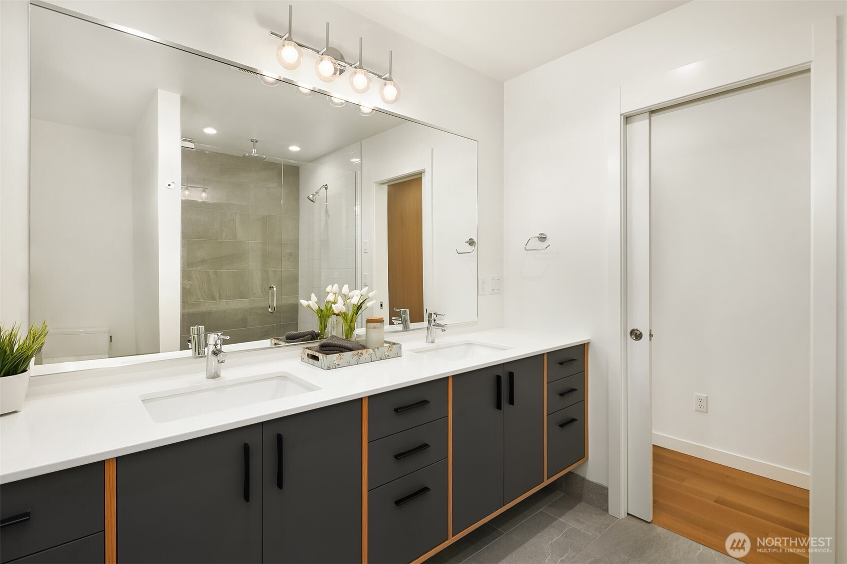Primary bathroom with double sinks & huge walk-in shower.