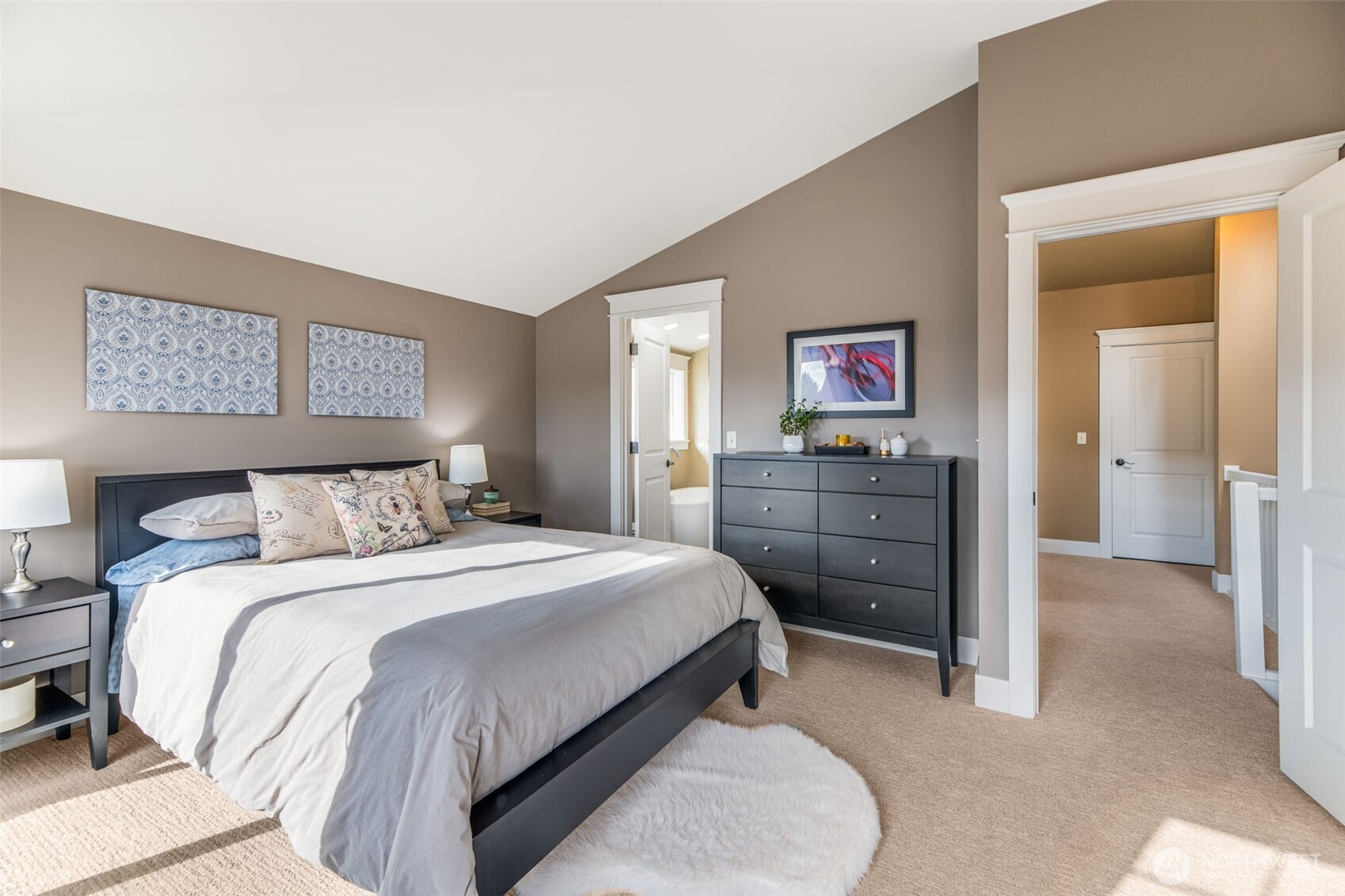 Primary suite with vaulted ceilings and attached bath