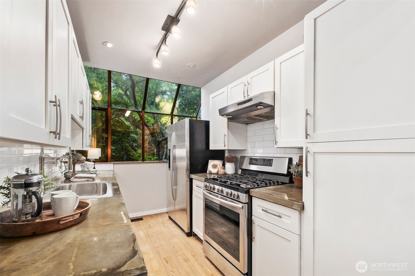 Crisp, updated subway tile backsplash enhances the kitchen design