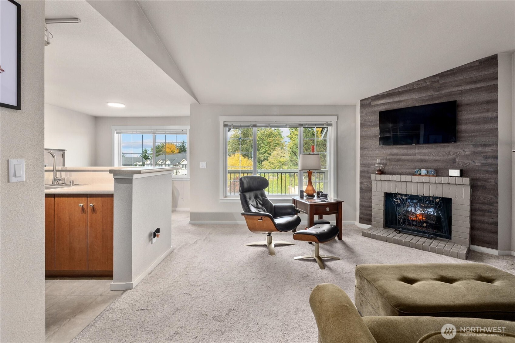 Light and bright, vaulted ceilings, wood burning fireplace currently has an electric insert that can be removed or stay.