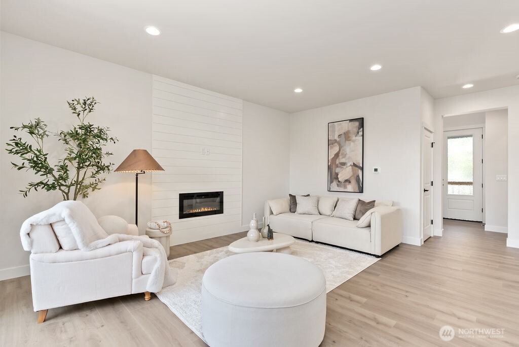 Interior photo shown is from a similar new construction home by the same builder. Fixtures, flooring, floor plan, and finishes are representative and may differ from the home currently under construction.