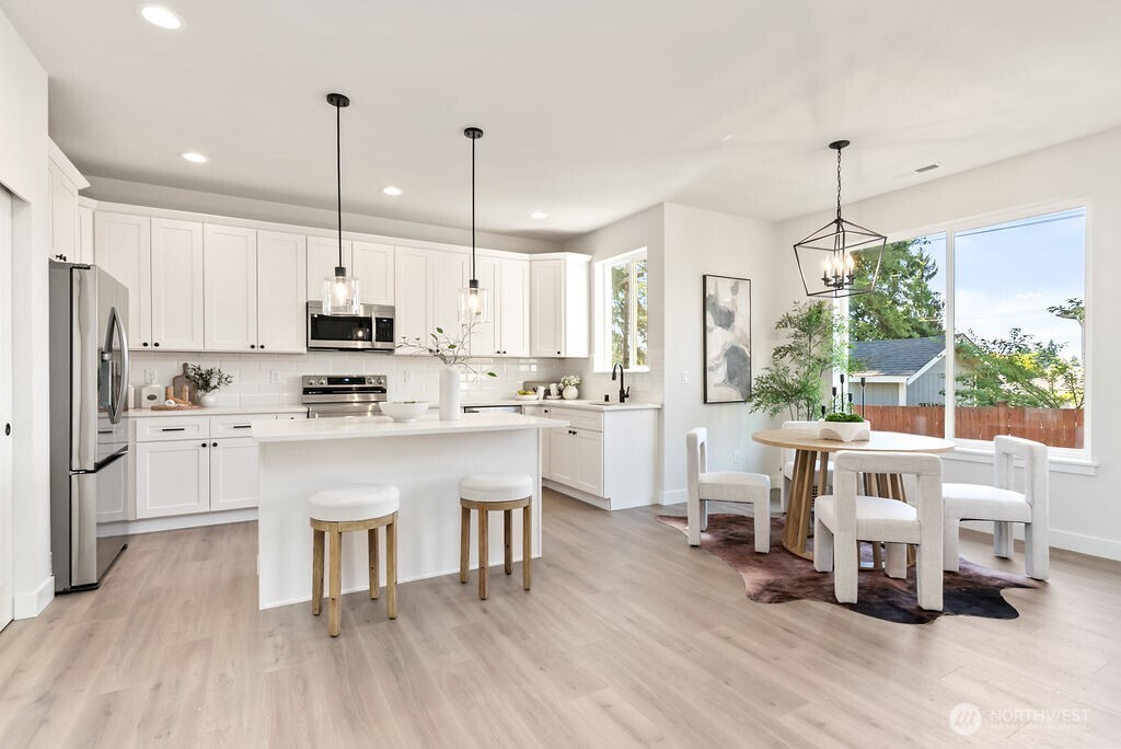 Interior photo shown is from a similar new construction home by the same builder. Fixtures, flooring, floor plan, and finishes are representative and may differ from the home currently under construction.