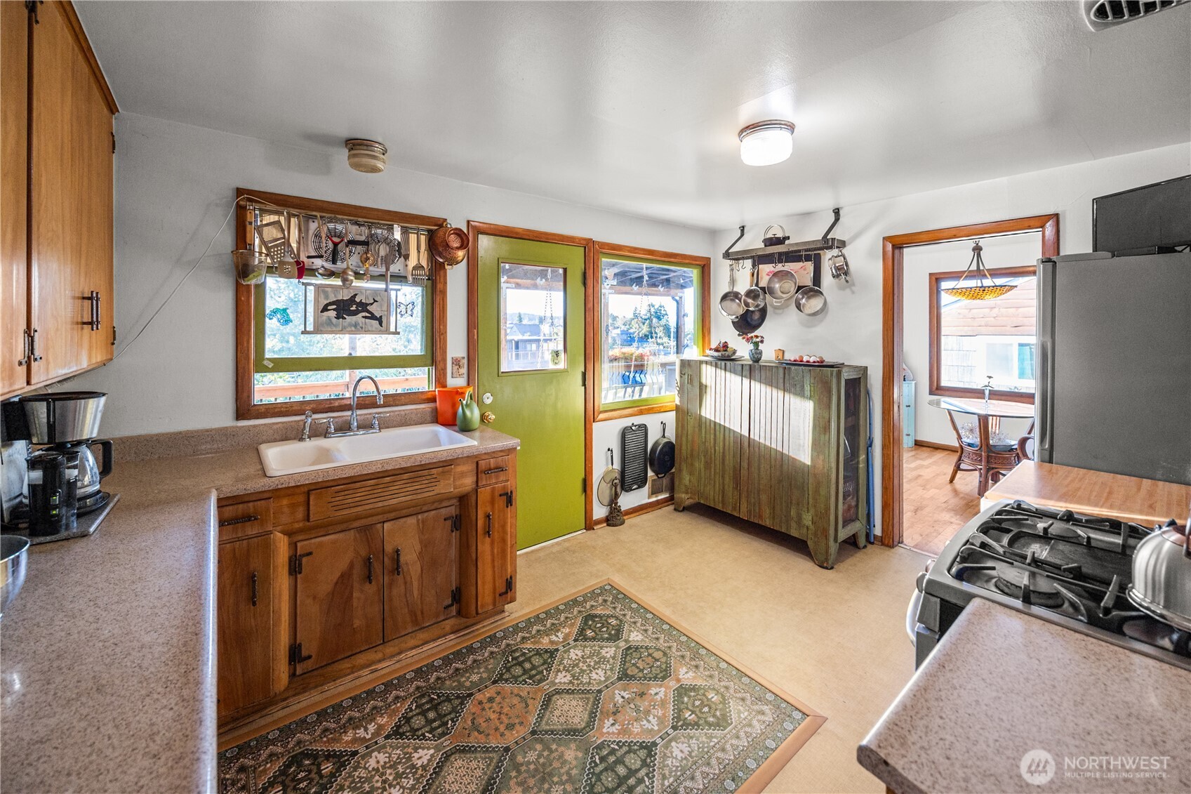 With a door leading to an expansive covered deck, dining al fresco can be a year round event.