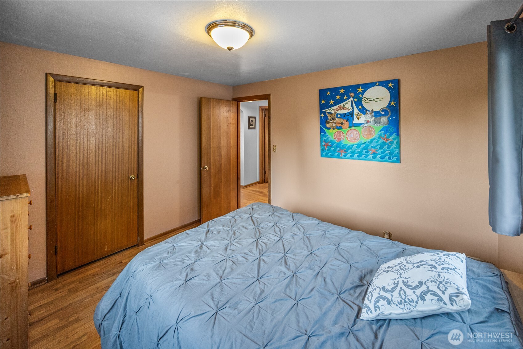 Bedroom number two on main floor- more gorgeous floors and beautiful, original mahogany wood work.