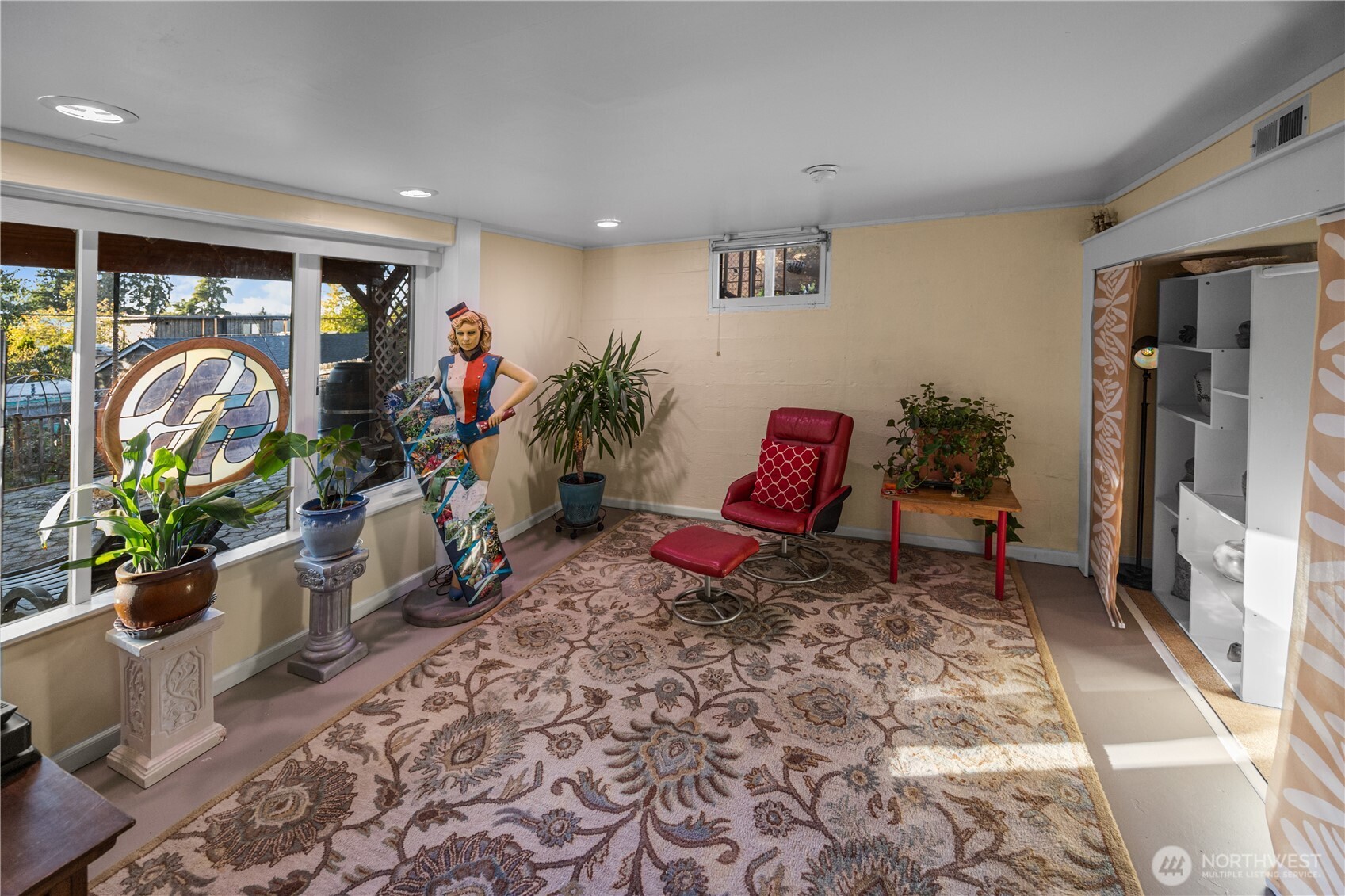 On the lower level you will find the 3rd bedroom. An almost full wall of windows lets the natural light shine in.