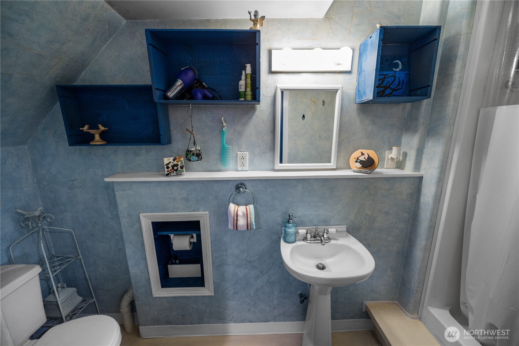 More fun, more whimsy- yes, it's a bathroom, but it's a fun one- with nooks and crannies and fun angles.