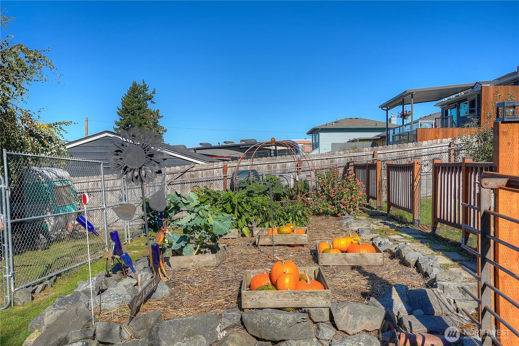 Covered deck above, covered patio below, and plenty of open air space. This is a really large yard, full of fun and spirit.