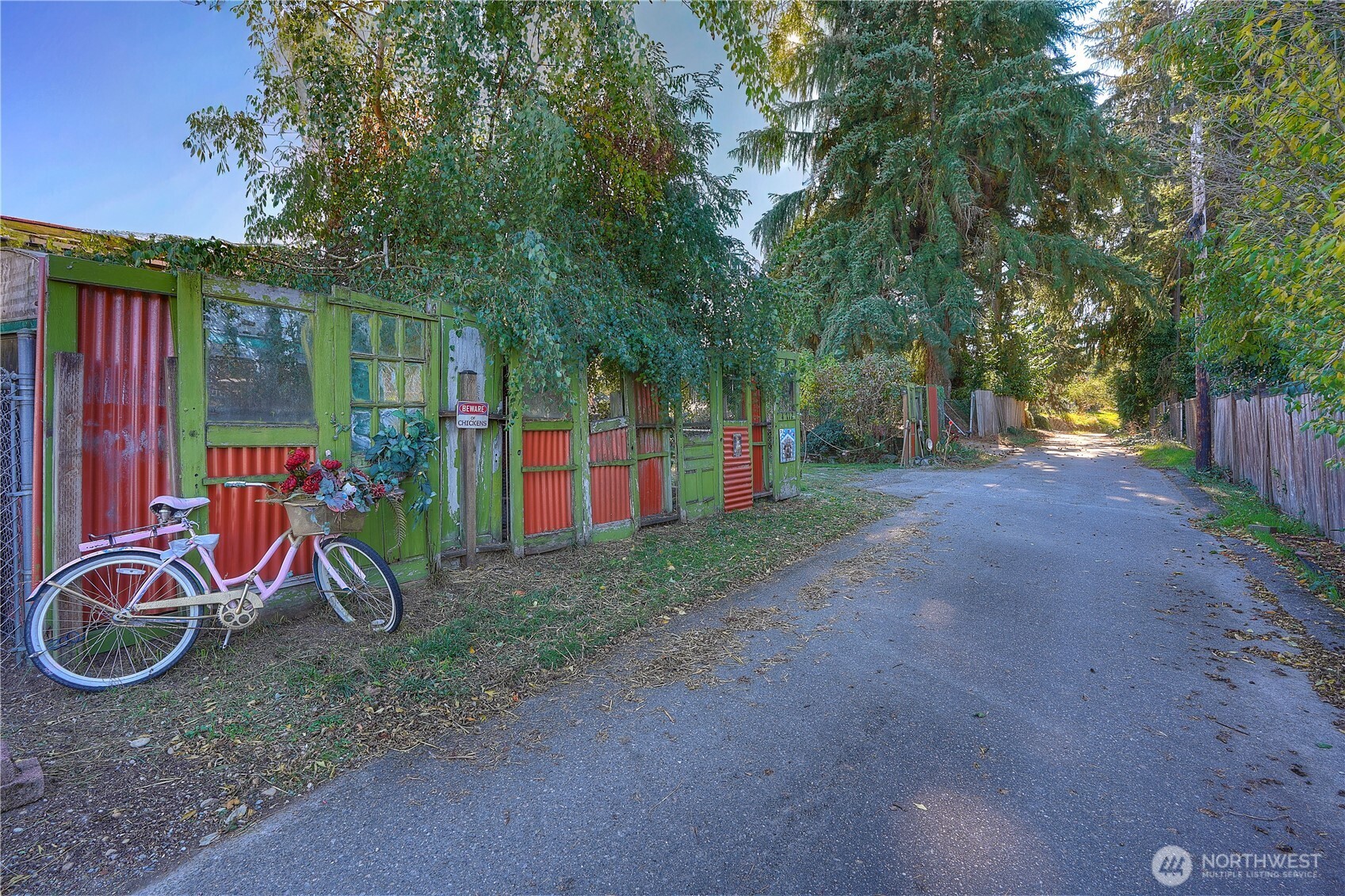 The lower fenced area is the hen house. Tons of off street parking available, as well as a one car garage.