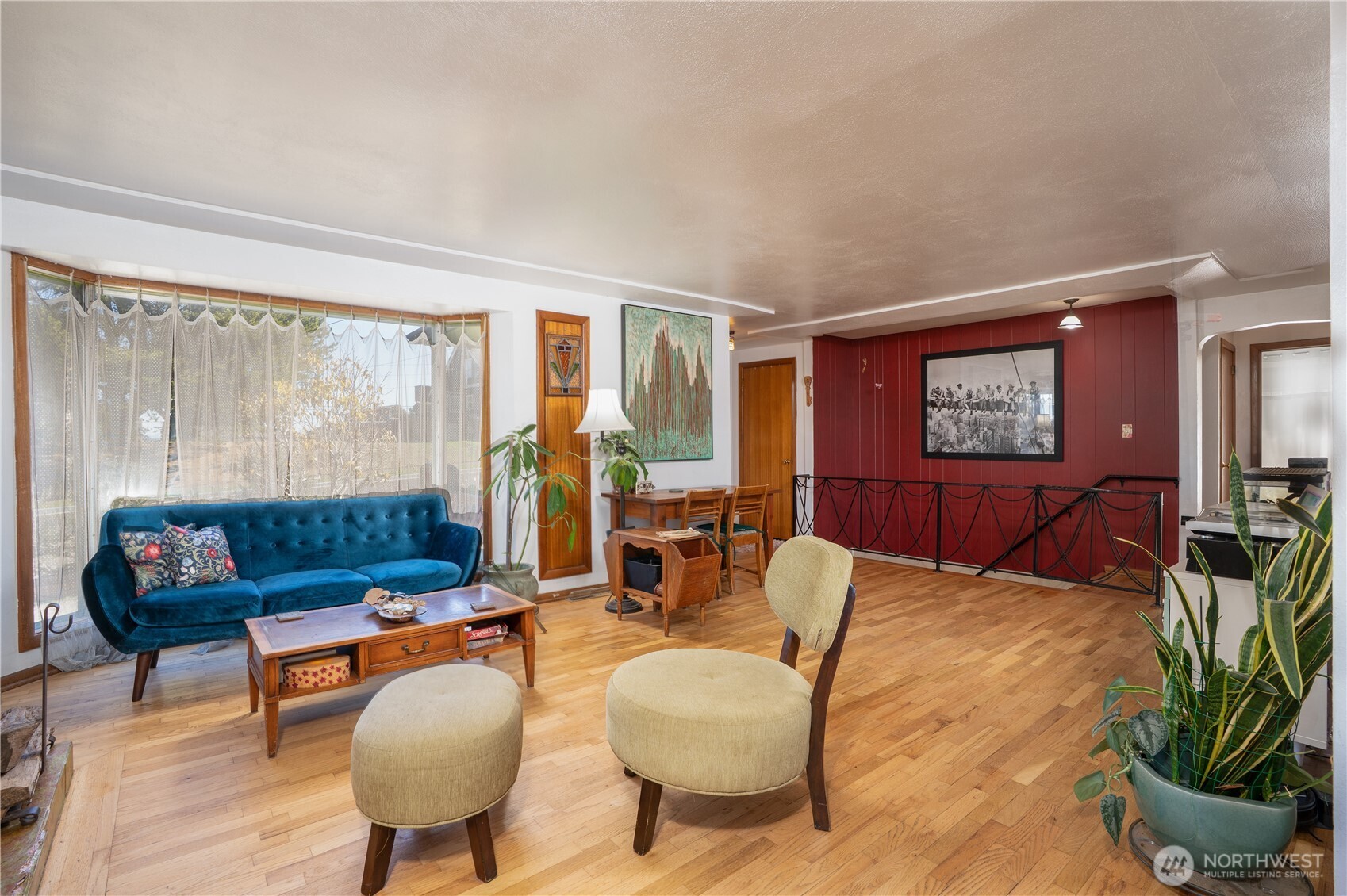 Sweet bay window, with a peek a boo view of the sound, makes for a lovely space to day dream, read, nap, or visit.