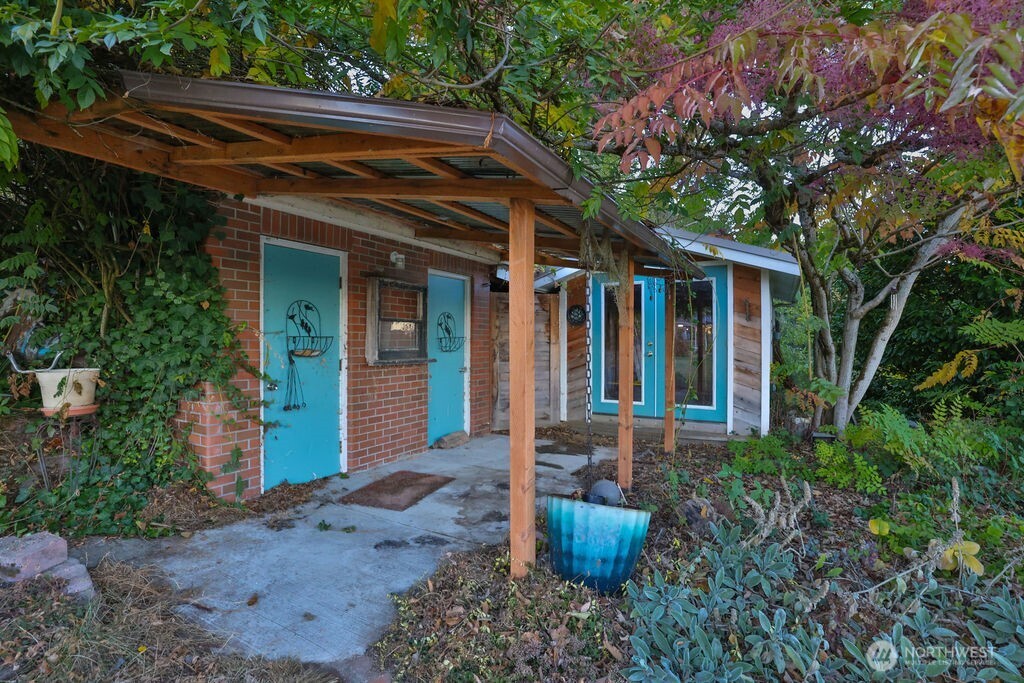 Doors to the left are the original the outhouses for the property have been decommissioned and used as storage.