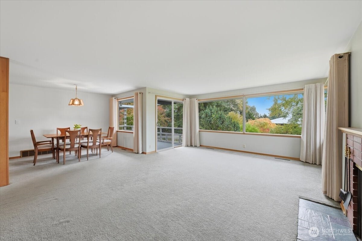 Living room with dining room on left, more built-ins.