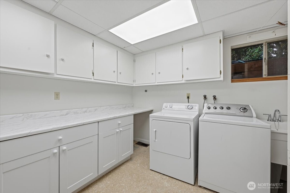 Huge laundry room with tons of storage.