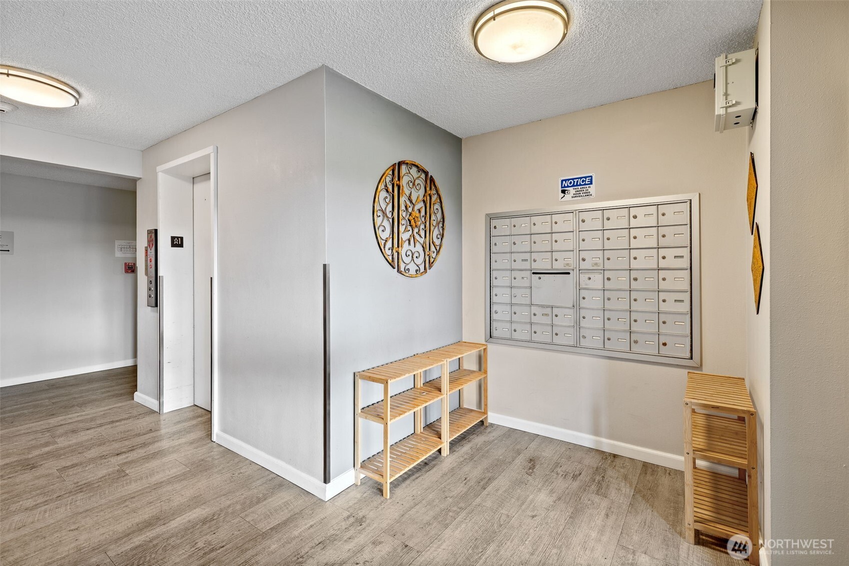 Main entrance with elevator and secured mailboxes.