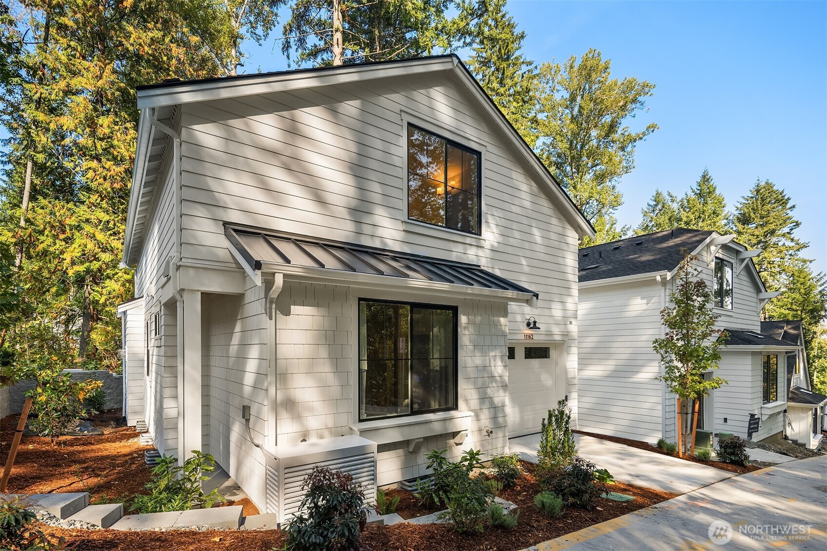 Neighboring cottage showing garage location.  Similar location to subject property, for demonstration purposes only.