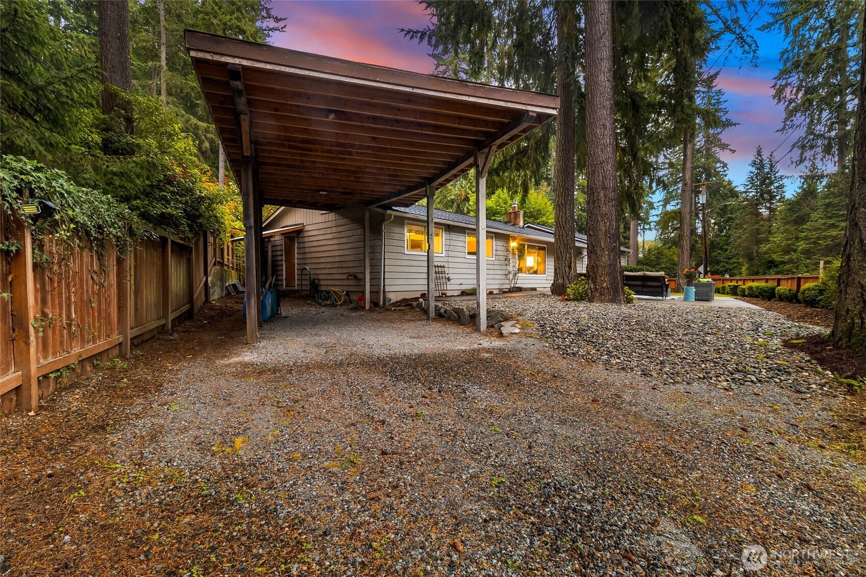 Covered RV Carport is fenced for privacy and security.
