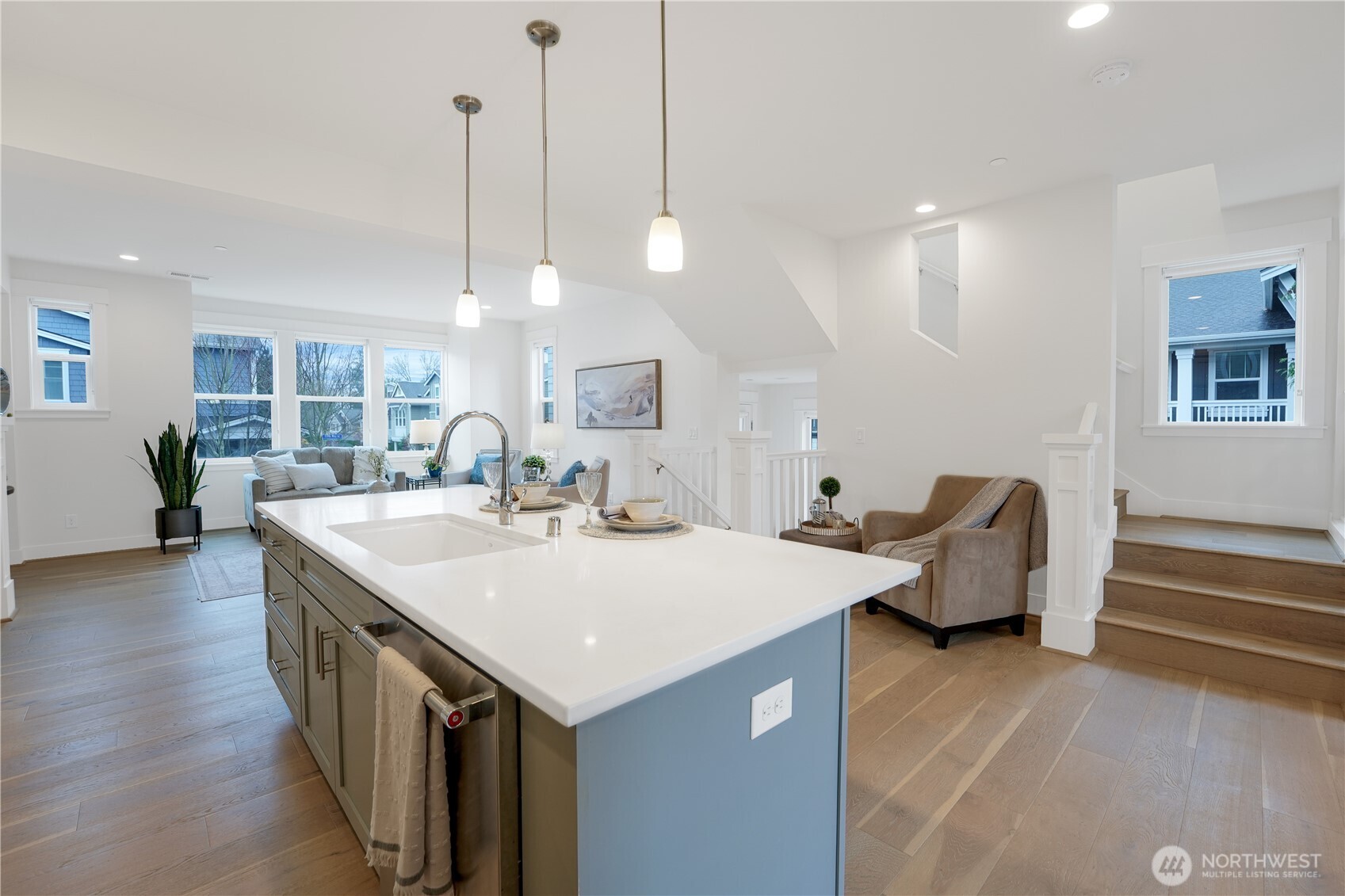 Another view of the kitchen looking towards a seating (or desk) nook.
