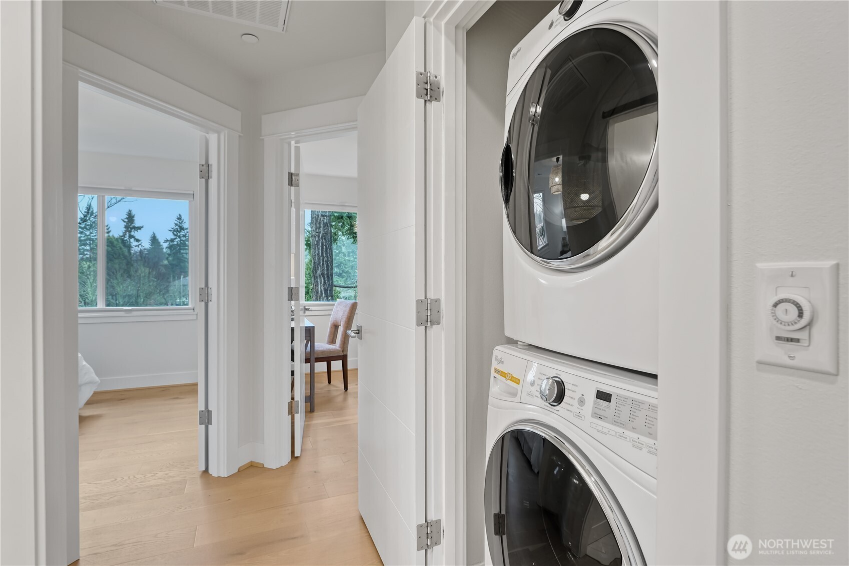 Conveniently located just outside the primary suite, the laundry closet features a full-sized washer and dryer.