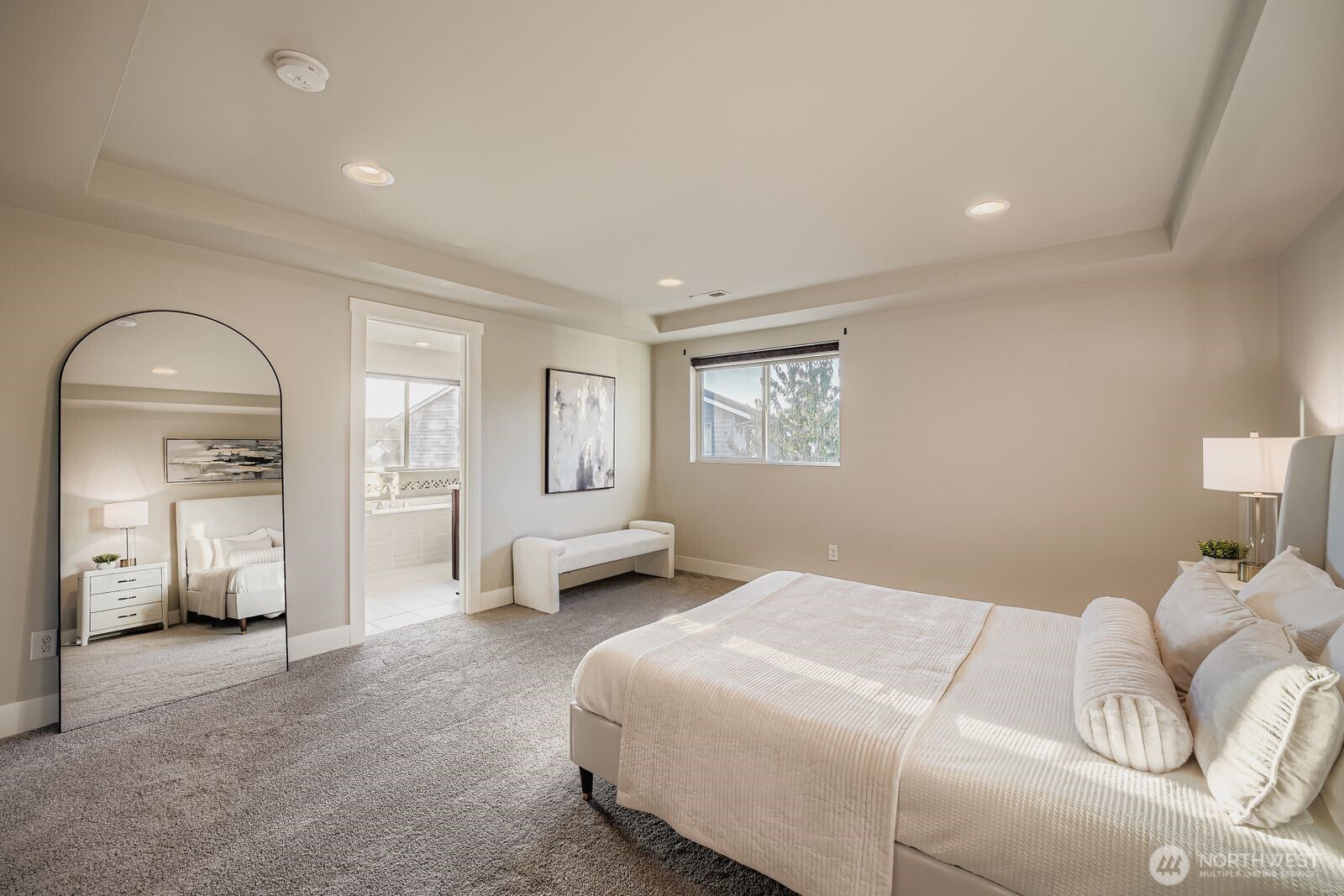 Primary bedroom with en suite bath and walk-in closet.