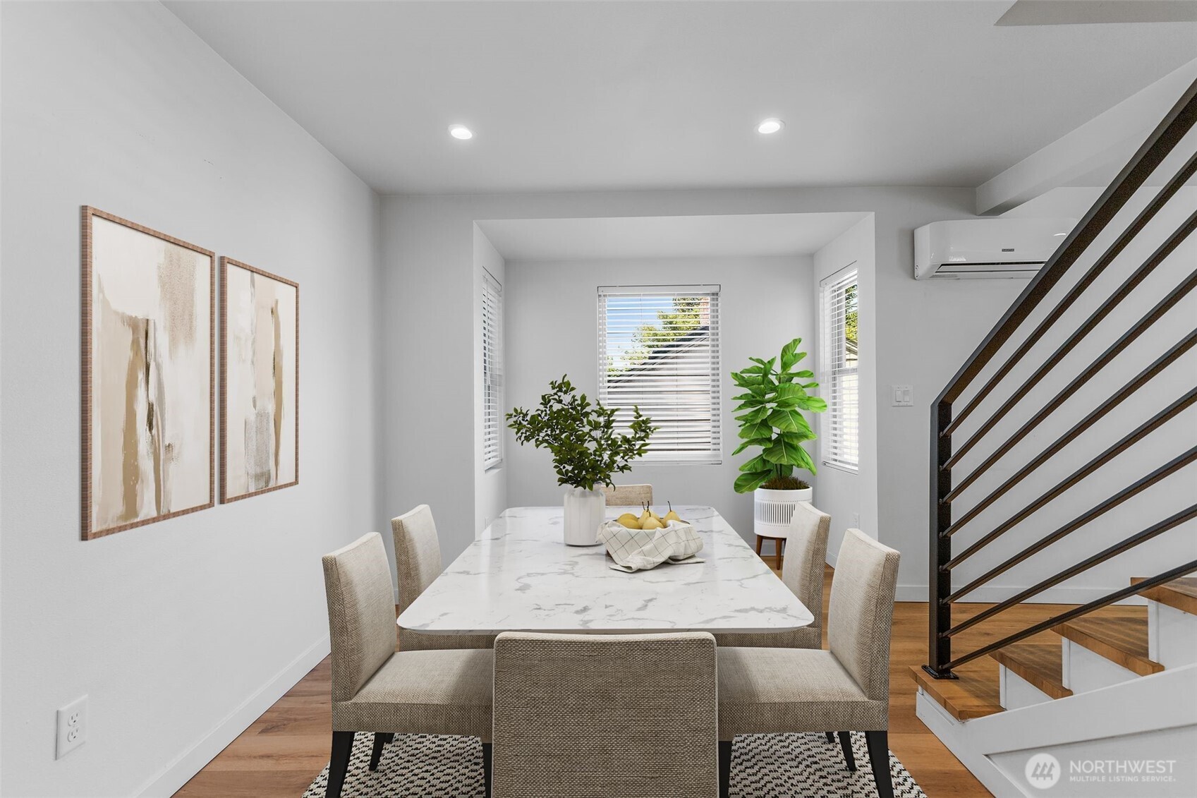 Open-concept flow perfect for both everyday dining and festive gatherings. Virtually staged.