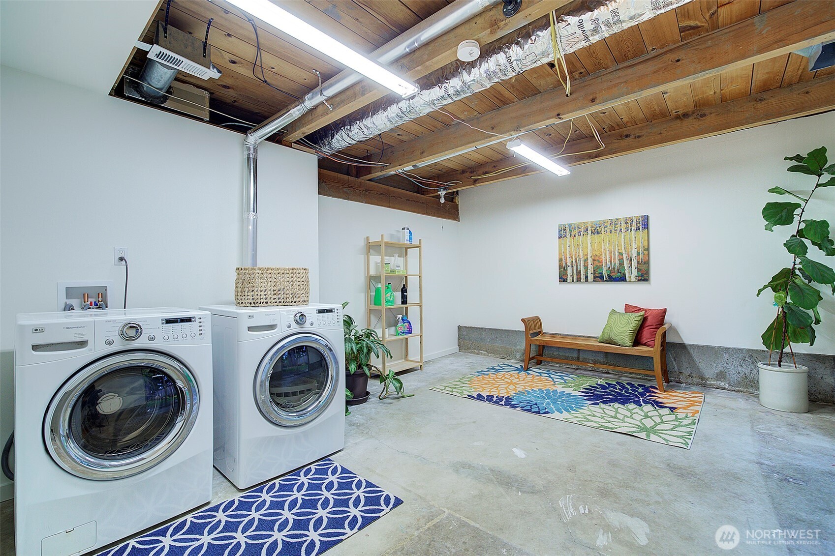 Lower level laundry area with lots of storage and slider to the backyard.