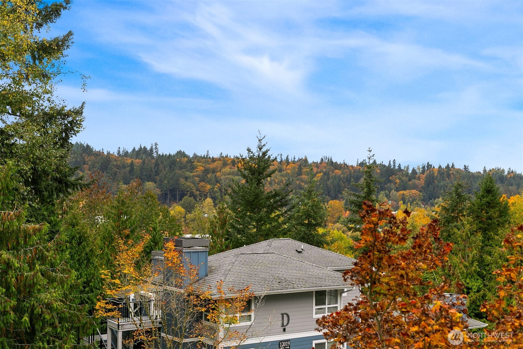 living room surrounded by green space