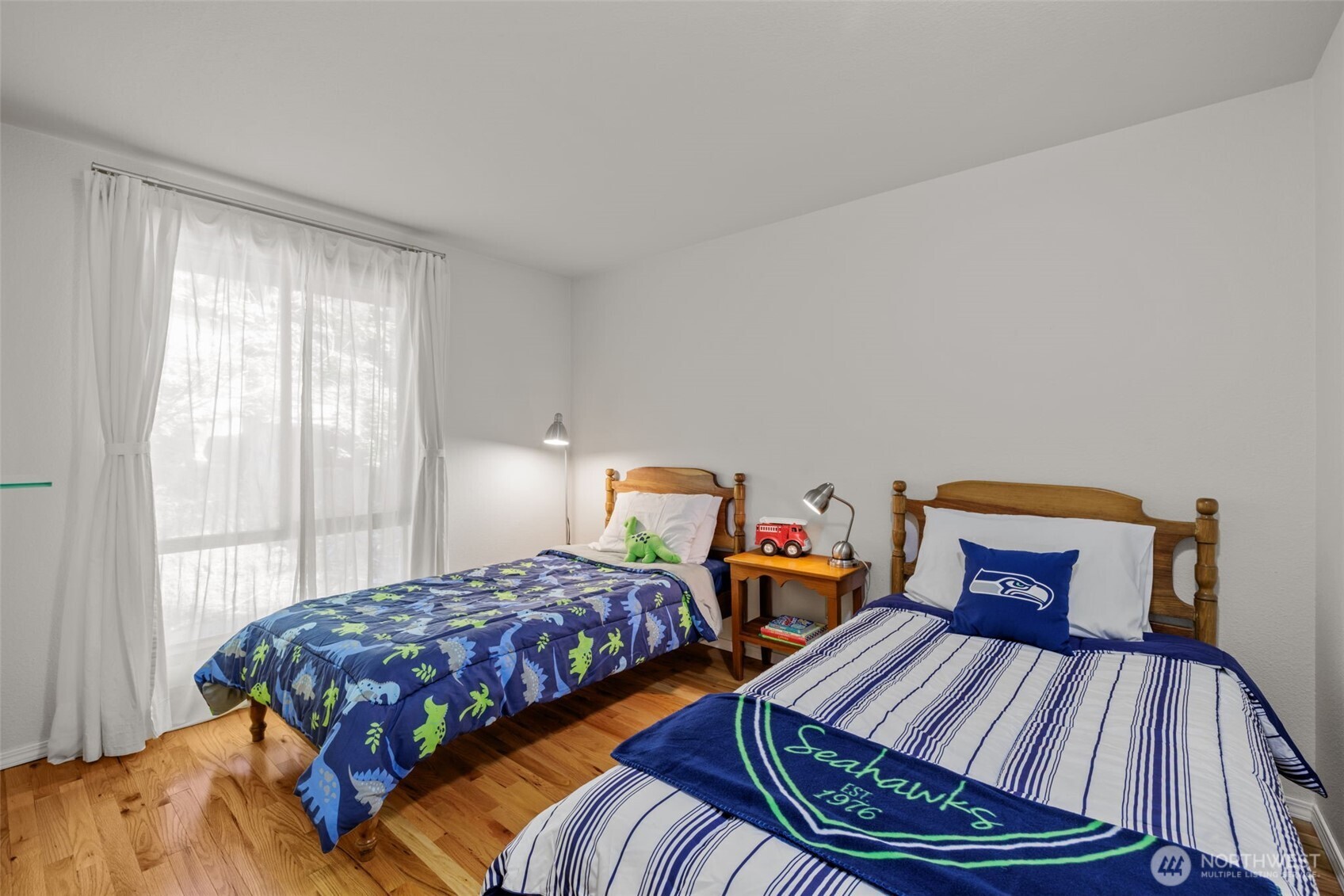 Bedroom 3 with hardwood floors.