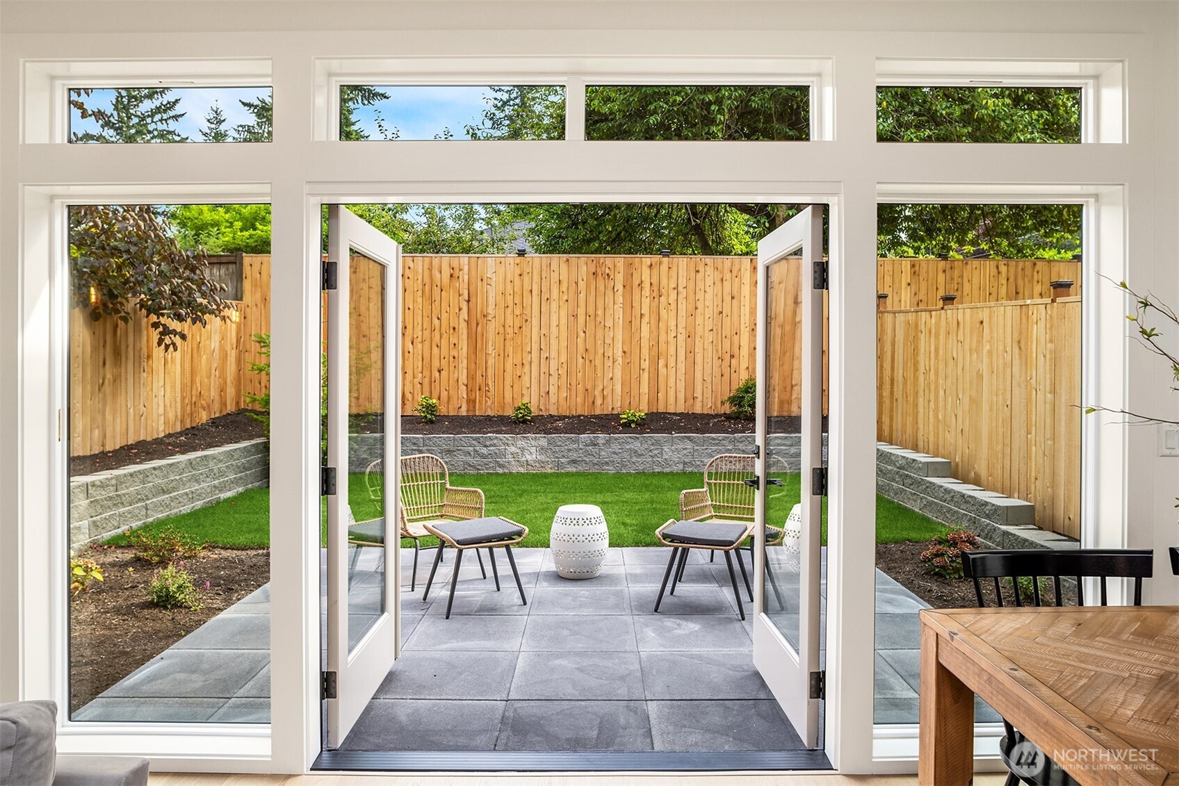 French doors leading out to patio and private yard