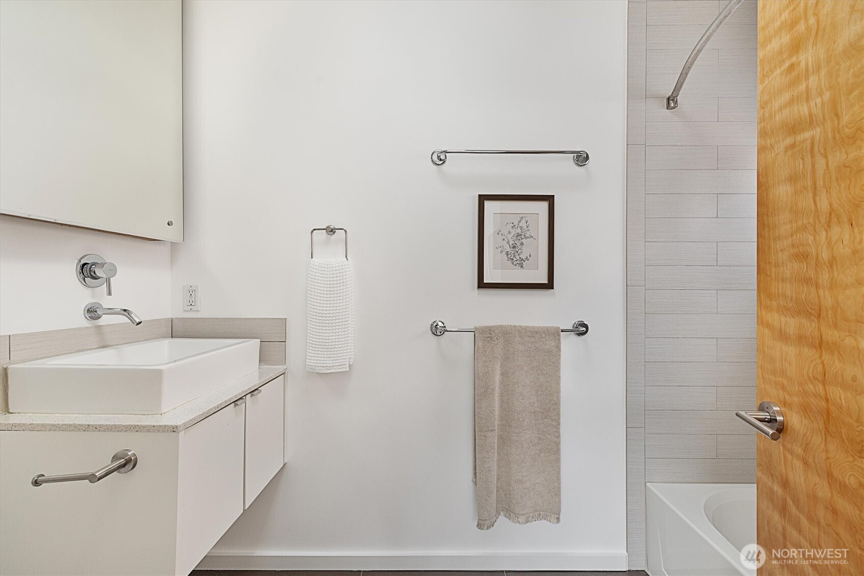 Primary bathroom with floating vanity, and a large soaking tub!