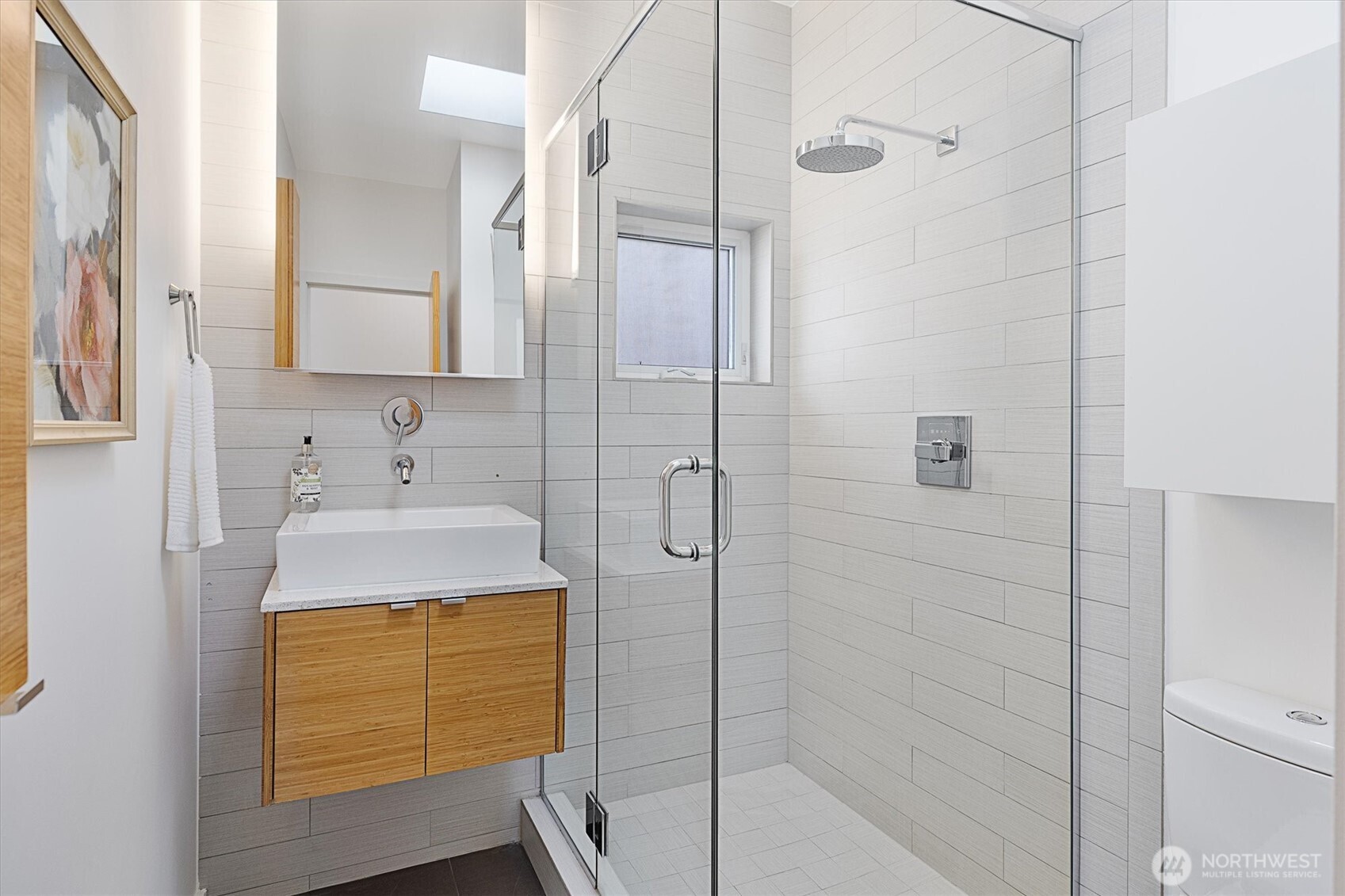 Beautiful guest bath with a gorgeous, glass-surround shower!