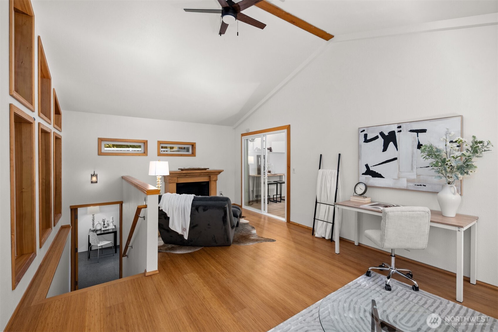 Sunroom leading down to basement storage room. Staged as an art room but could be used as wine storage or even an unheated workout room?? The possibilities are endless!!