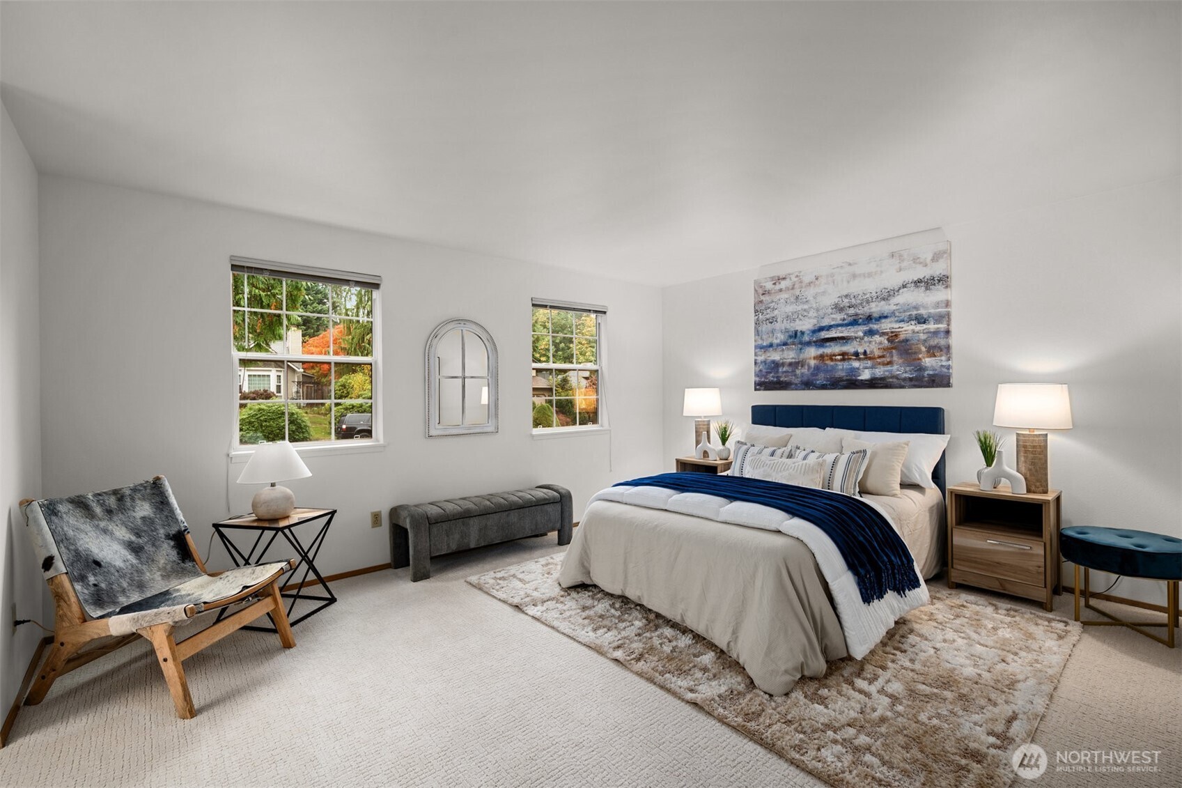 Primary suite roomy and bright and features an ensuite bathroom.