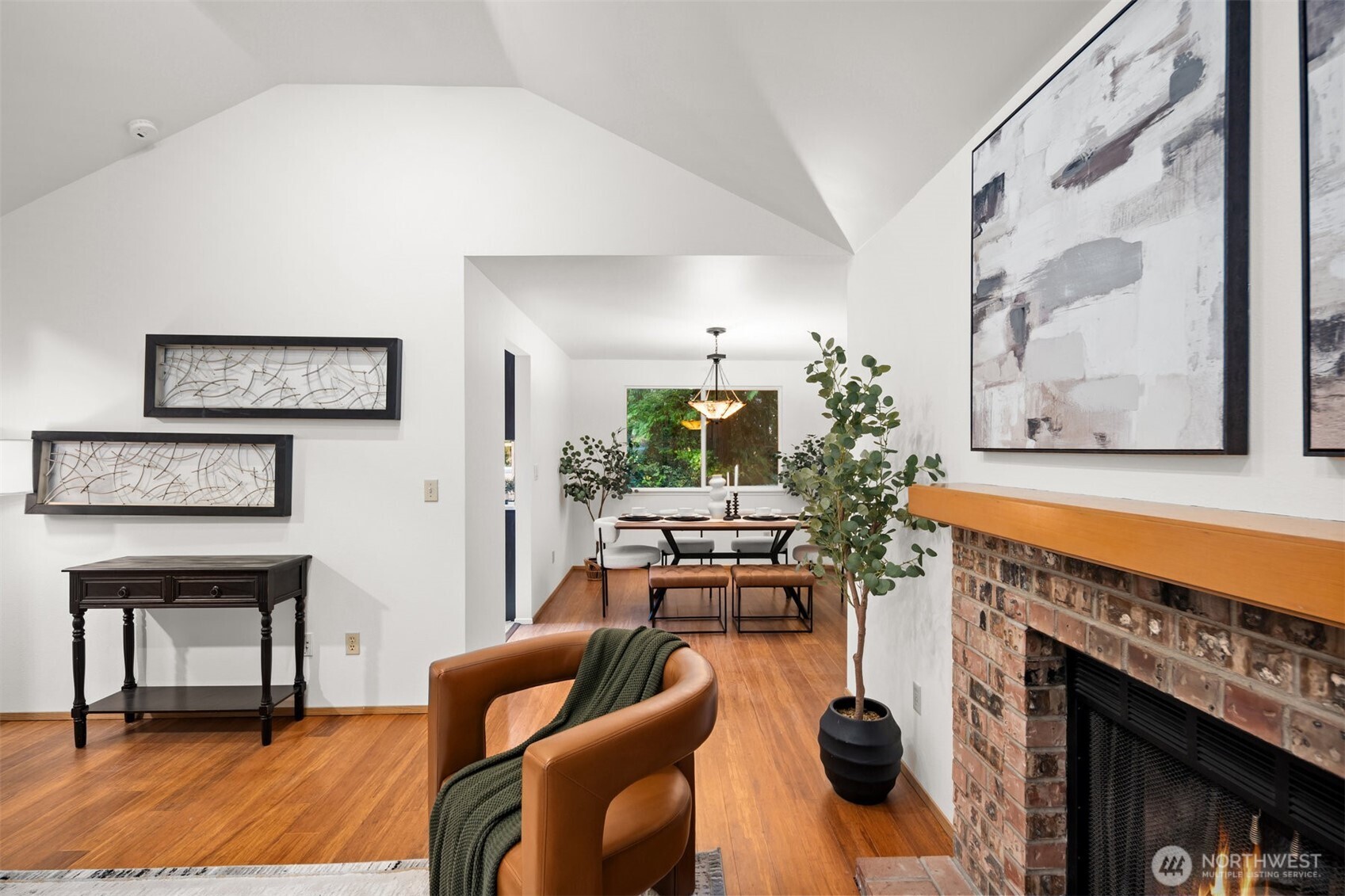 Living room leading into dining room. Sustainable bamboo flooring.