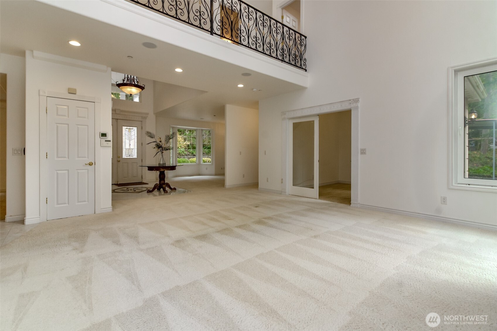 Open concept living looking toward entry