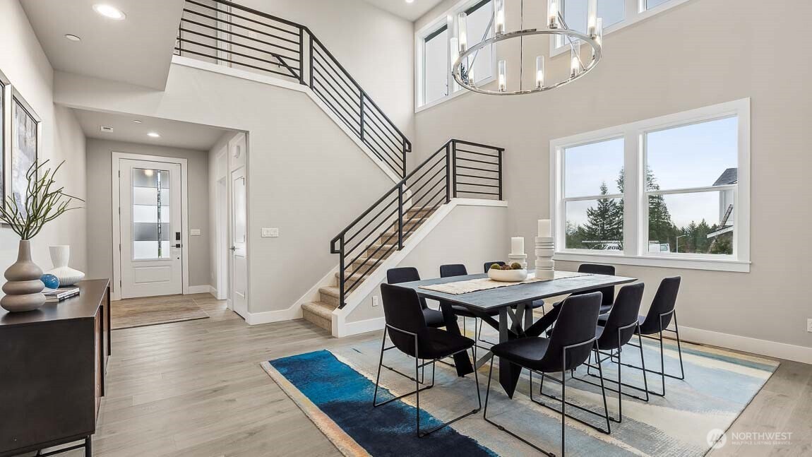 Dramatic 2-story formal dining room, showing similar floorplan (colors & finishes will vary)