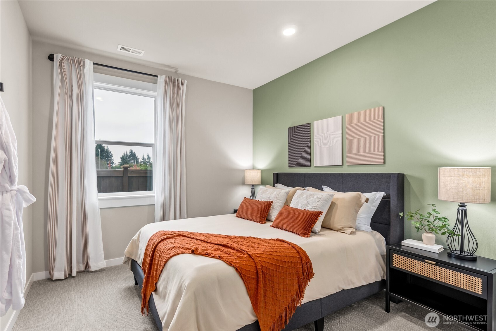 Bedroom on main floor, showing similar plan within community.  Includes walk in closet + adjacent to 3/4 bath!