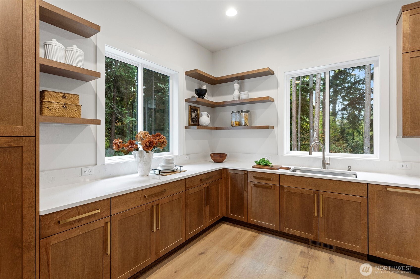 A stunning chef’s kitchen complemented by a full prep kitchen for effortless entertaining.
